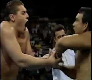 Ricky Steamboat grabs Lord Steven Regals Finger in a match on WCW Main Event, August 1993
