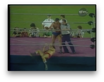 Dominic DeNucci hangs onto the ropes at WWF Showdown at Shea 1980